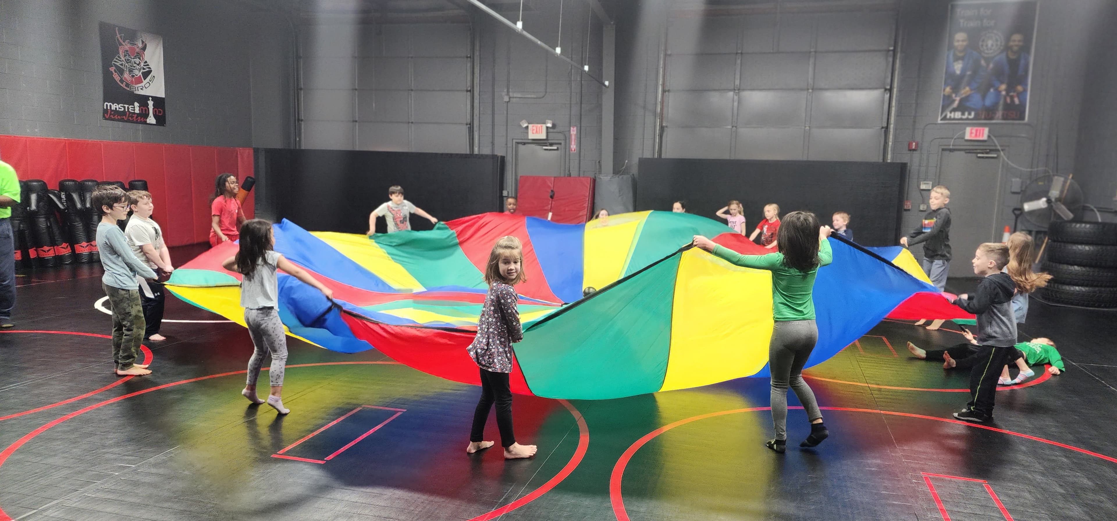 Campers playing a parachute game at Plainfield's Best Summer Camp