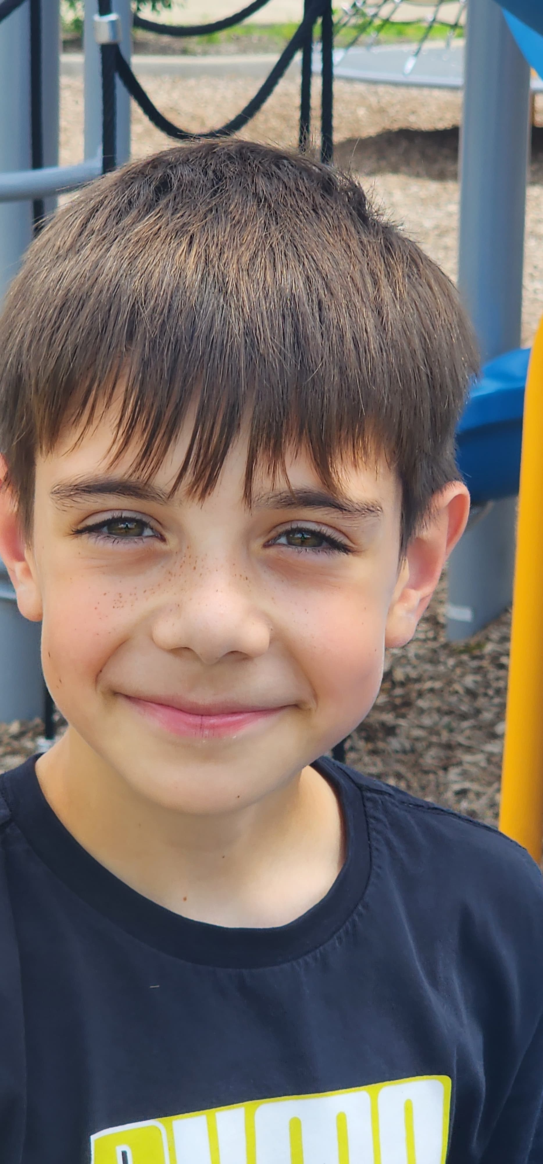 Smiling camper on the playground