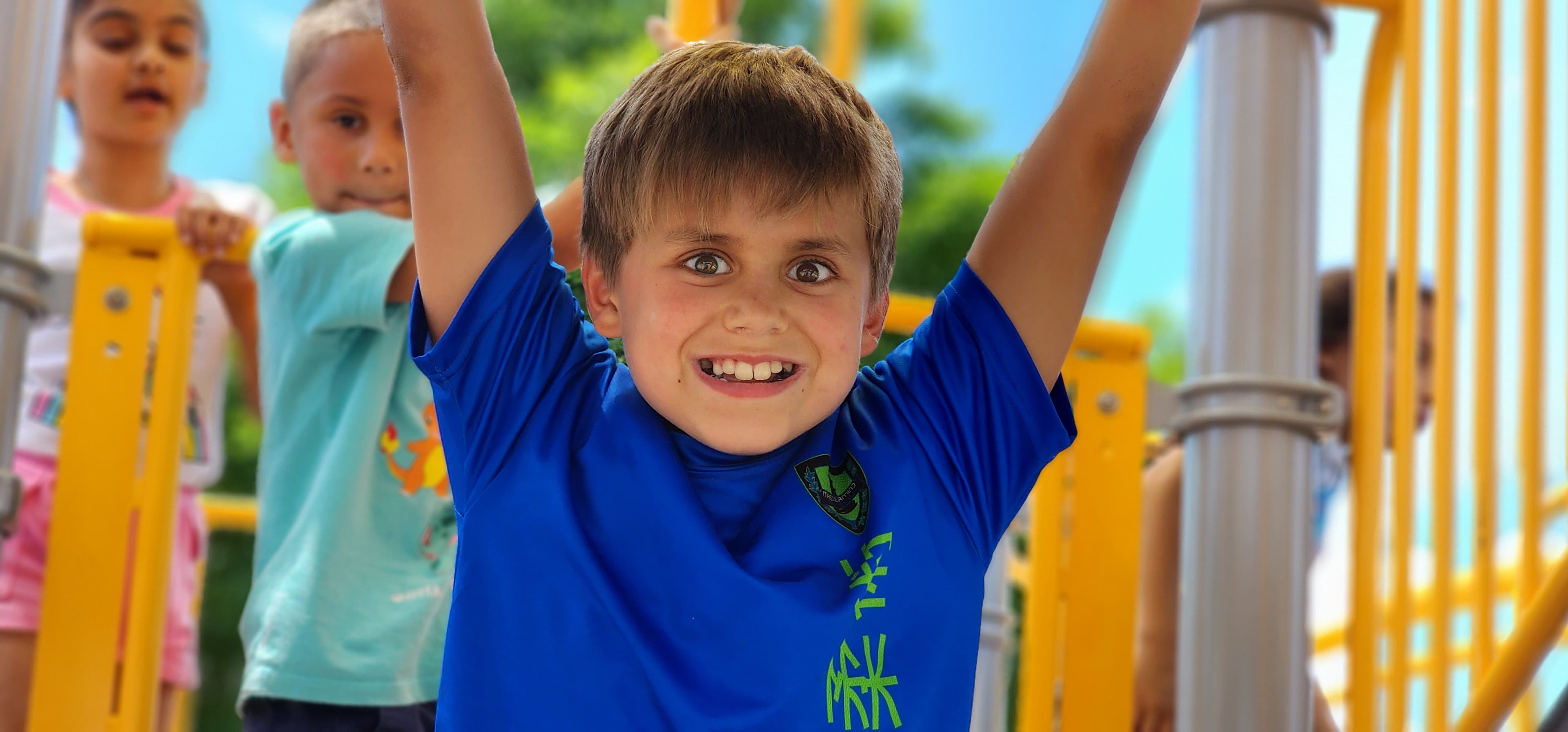Camper celebrating on the playground