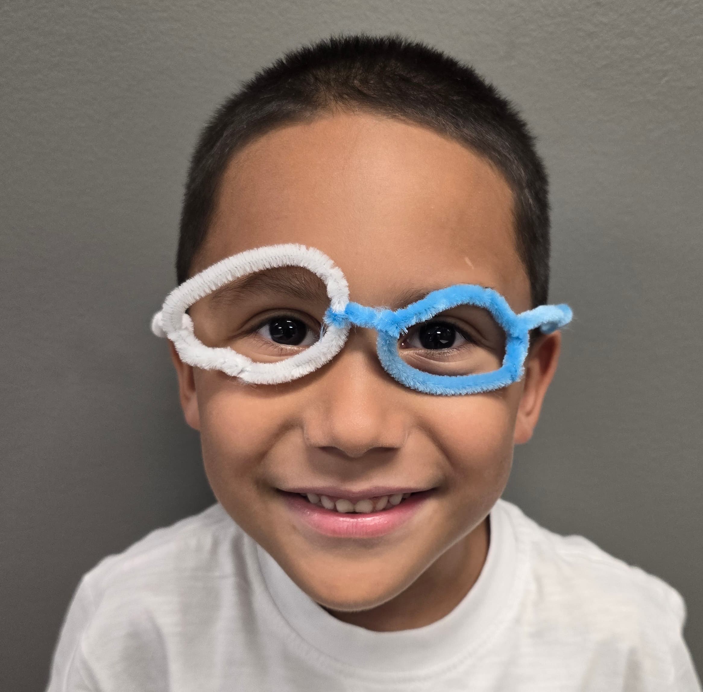 Camper wearing pipe-cleaner glasses