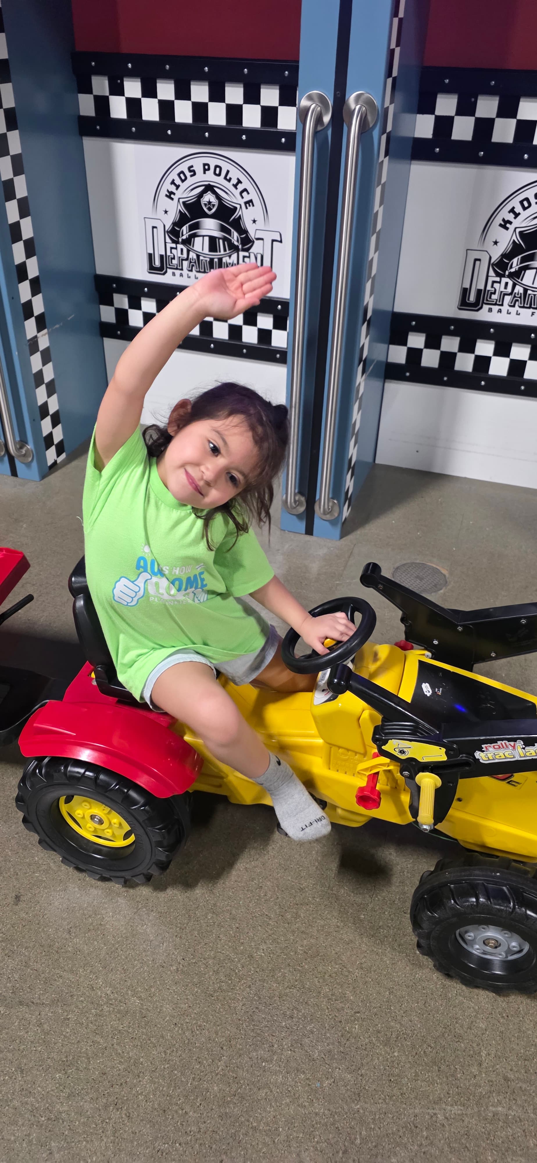 Camper on a ride-on toy tractor